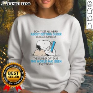 Alt Text: Official Snoopy sweatshirt featuring Don't Get All Weird About Getting Older design, celebrating aging with humor.