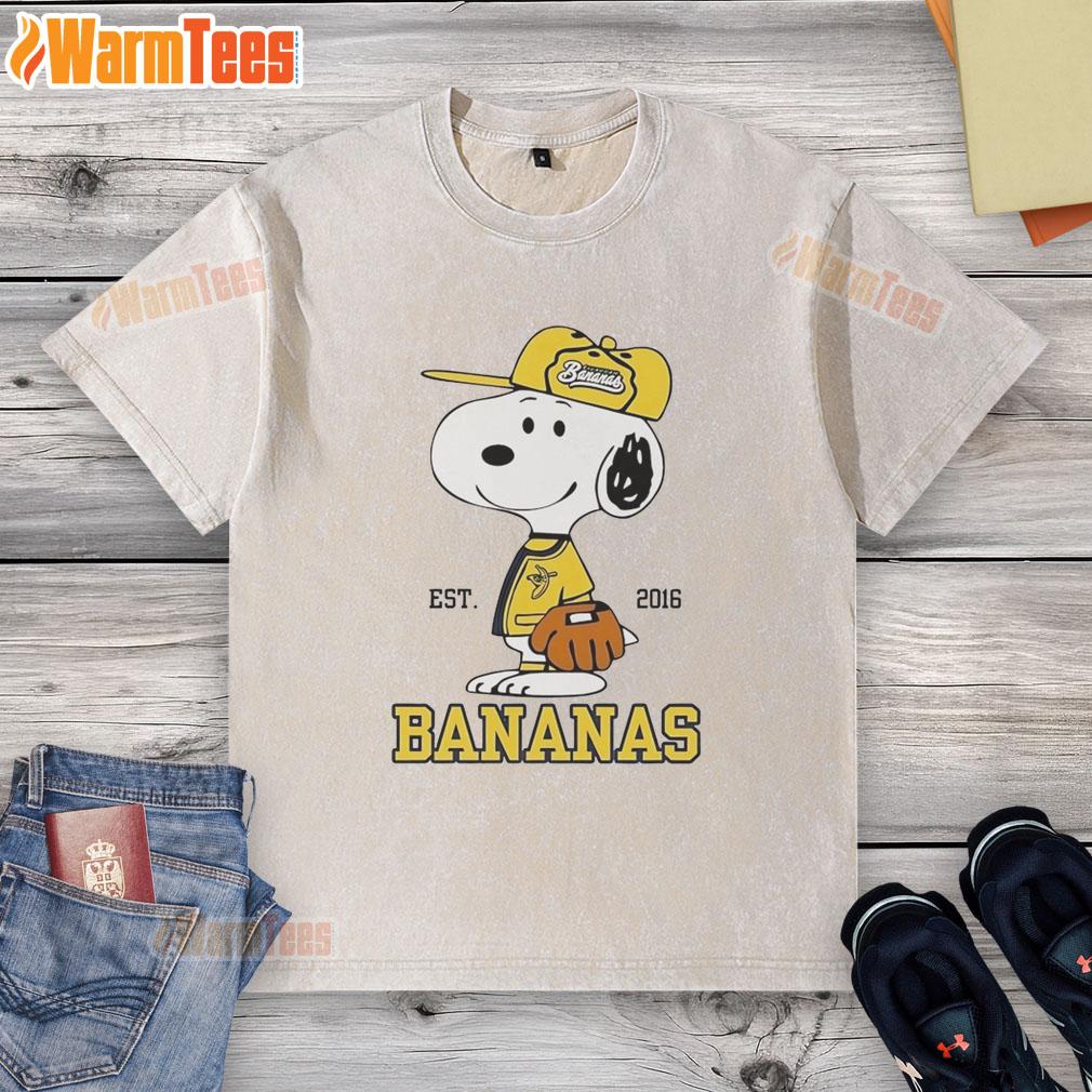 cute-snoopy-wearing-savannah-bananas-outfit-est-2016-washed-t-shirt Cute Snoopy wearing a Savannah Bananas outfit on a washed t-shirt, established in 2016, perfect for fans.