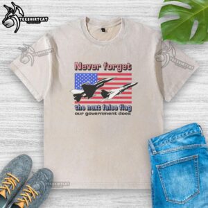 Official Never Forget The Next False Flag Our Government Does washed t-shirt featuring bold text and casual style.