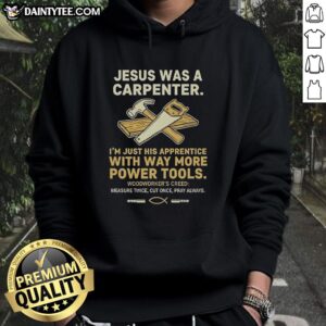 Man wearing 'Nice Jesus Was A Carpenter' hoodie with tools, showcasing the fun design for carpenters and DIY enthusiasts.