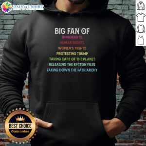 Protester wearing 'Awesome Big Fan of Immigrants Human Rights' hoodie, advocating for women's rights and environmental care.