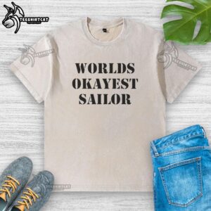 Alt Text: Official World's Okayest Sailor washed t-shirt in navy blue, featuring playful design for casual nautical enthusiasts.