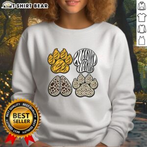 Cozy Pretty Animal Print Paws Sweatshirt featuring vibrant animal paw designs on a soft fabric background.
