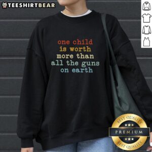 Child Worth More Than All Guns Sweatshirt design featuring a powerful message on peace and value of children.
