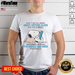 Alt Text: Snoopy graphic t-shirt with 'Don't Get All Weird About Getting Older' quote, celebrating age as just a number.