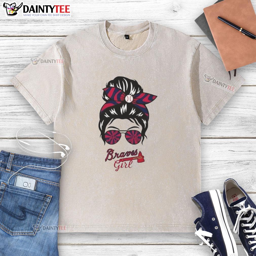 good-atlanta-braves-girl-messy-bun-glasses-washed-t-shirt Alt Text: Cheerful girl with messy bun and glasses wearing a washed Atlanta Braves t-shirt, showcasing team spirit.
