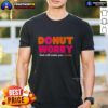 Good Donut Worry God Will Make You Whole T-Shirt featuring a colorful donut graphic and inspirational text design.