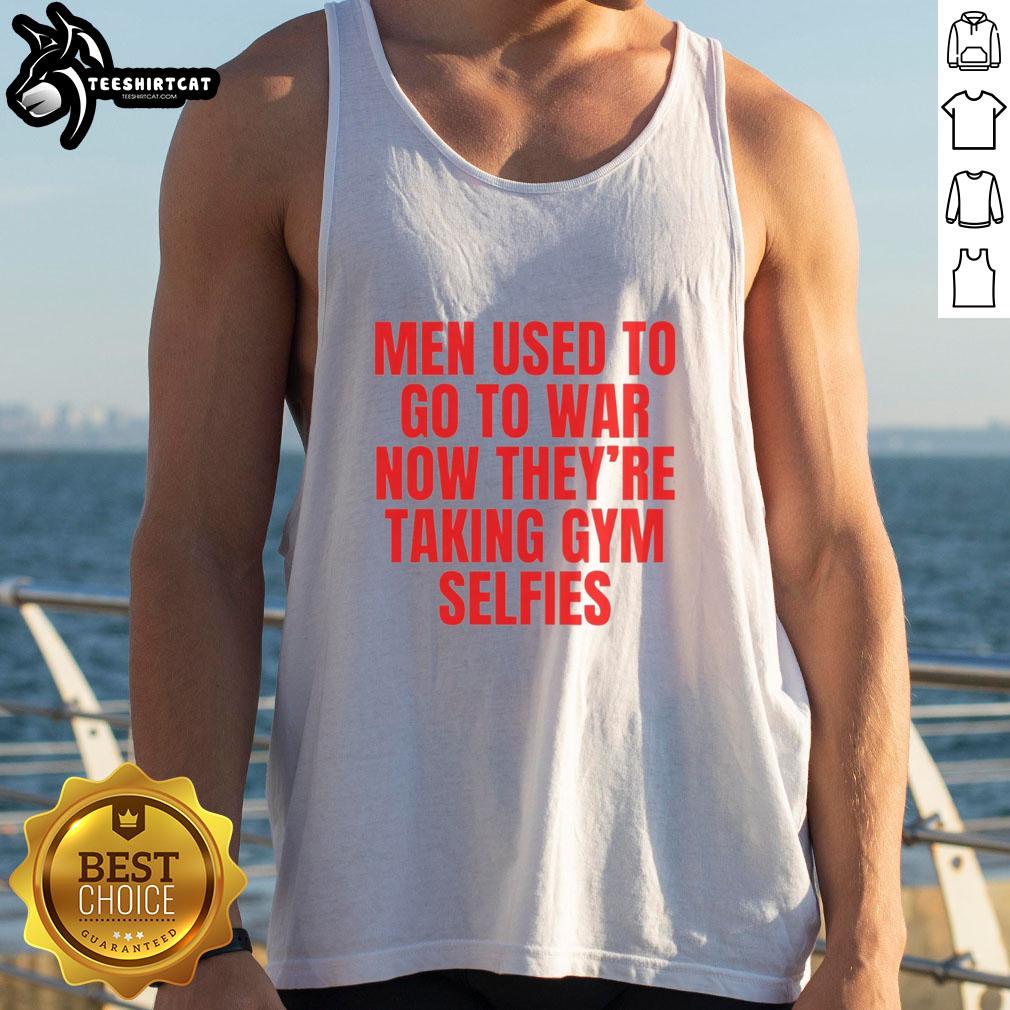 good-men-used-to-go-to-war-now-theyre-taking-gym-selfies-tank-top Man in tank top flexing in gym, embodying the phrase 'Good Men Used To Go To War, Now Theyre Taking Gym Selfies.'