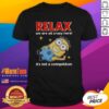Alt Text: Good Minion lying relaxed on a t-shirt with the phrase We Are All Crazy Here! It's Not A Competition.