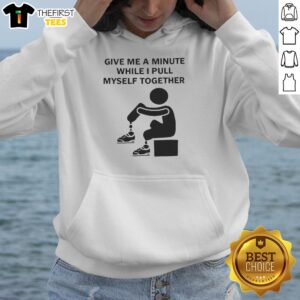 Cozy 'Pretty Give Me A Minute While I Pull Myself Together' hoodie displayed on a hanger, perfect for casual style.