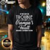 Funny T-shirt design saying 'Hot If We Get In Trouble It's My Grandpa's Fault Because I Listened To Him' for humor lovers.