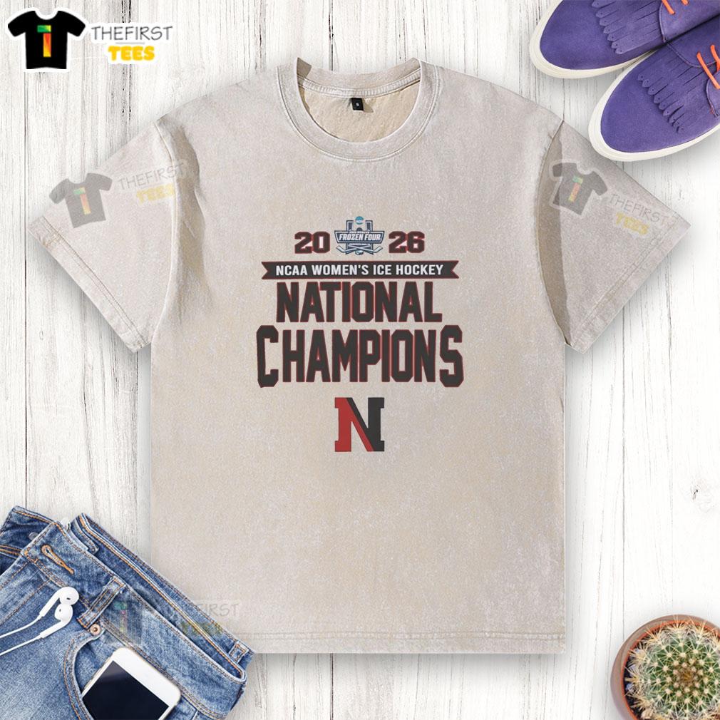 hot-northeastern-huskies-ncaa-womens-ice-hockey-frozen-four-champions-2026-washed-t-shirt Alt Text: Northeastern Huskies NCAA Women's Ice Hockey Frozen Four Champions 2026 washed t-shirt featuring team logo and design.