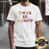 Alt Text: Hot This Is March sport team logo t-shirt featuring vibrant colors and bold graphics for sports enthusiasts.