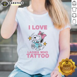Original Snoopy wearing a pink bow on a tee shirt that says 'I Love Ladies Who Tattoo Ladies' in vibrant colors.