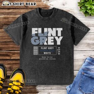Alt Text: Stylish Pretty Flint Grey French Blue White Label Washed T-Shirt on a wooden background, perfect for casual outfits.