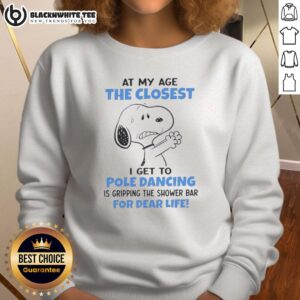 Cozy sweatshirt featuring Snoopy with the quote about aging and shower bars, perfect for Peanuts fans.