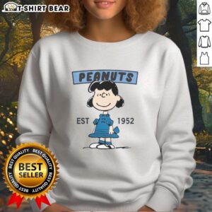 Alt Text: Pretty Peanuts Lucy Smile Est 1952 sweatshirt in soft fabric, featuring a vibrant graphic of Lucy from Peanuts.