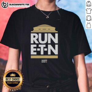 Stylish Top Run E.T.N. Saints Now ladies tee featuring a vibrant design, perfect for female fans of the New Orleans Saints.