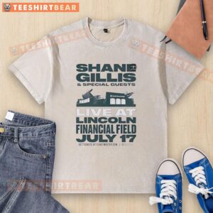 Shane Gillis performing live at Lincoln Financial Field on July 17, wearing a washed T-shirt with special guests.