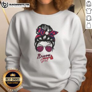 Alt Text: Stylish girl in a messy bun and glasses wearing a trendy Atlanta Braves sweatshirt, perfect for game day.