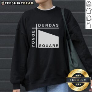 Stylish Pretty Yonge Dundas Square sweatshirt displayed against a vibrant urban backdrop, perfect for city fashion.