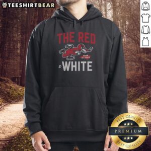 Alt Text: Red and white NC State football hoodie displayed on a hanger, showcasing team logo and stylish design.