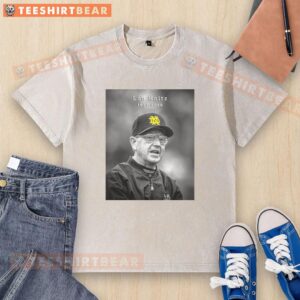 Alt Text: Hot Legendary Notre Dame Coach Lou Holtz 1937-2026 washed t-shirt featuring vintage design and iconic coach imagery.