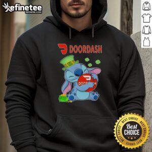 Alt Text: Cute Stitch hugging DoorDash logo on St. Patrick's Day hoodie, perfect for festive delivery enthusiasts.