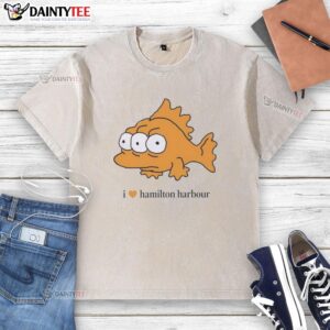 Good I Love Hamilton Harbour washed t-shirt displayed on a wooden background, showcasing its vibrant color and relaxed fit.