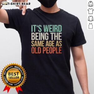 Vintage T-shirt featuring 'It's Weird Being The Same Age As Old People' design, perfect for quirky fashion lovers.