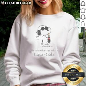 Cute Snoopy drinking Coca-Cola on a cozy sweatshirt, perfect for fans of casual and playful fashion.