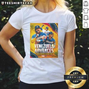 Alt Text: Team Venezuela celebrates victory over Team USA in the 2026 World Baseball Classic, wearing stylish ladies' tees.