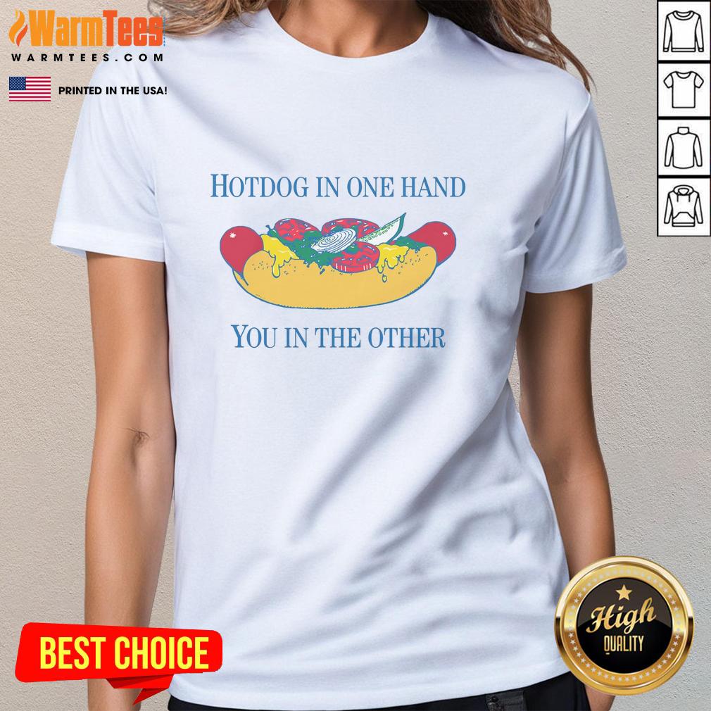 nice-hotdog-in-one-hand-you-in-the-other-ladies-tee Alt Text: Woman holding a nice hotdog in one hand and a drink in the other while wearing a stylish ladies tee.