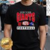 Alt Text: New York Giants NFL football helmet logo t-shirt featuring a bold design and team colors, perfect for fans.