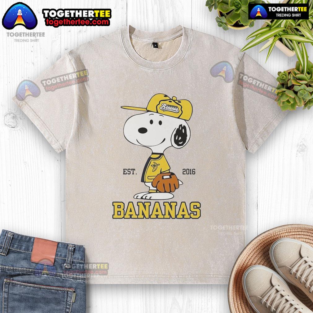 Nice Snoopy Wearing Savannah Bananas Outfit Est 2016 Washed T Shirt Snoopy wearing a Savannah Bananas outfit on a washed t-shirt, showcasing a fun and stylish baseball-themed design.