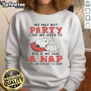 Cozy sweatshirt featuring Snoopy with 'We may not party like we used to' quote, perfect for casual wear and napping.