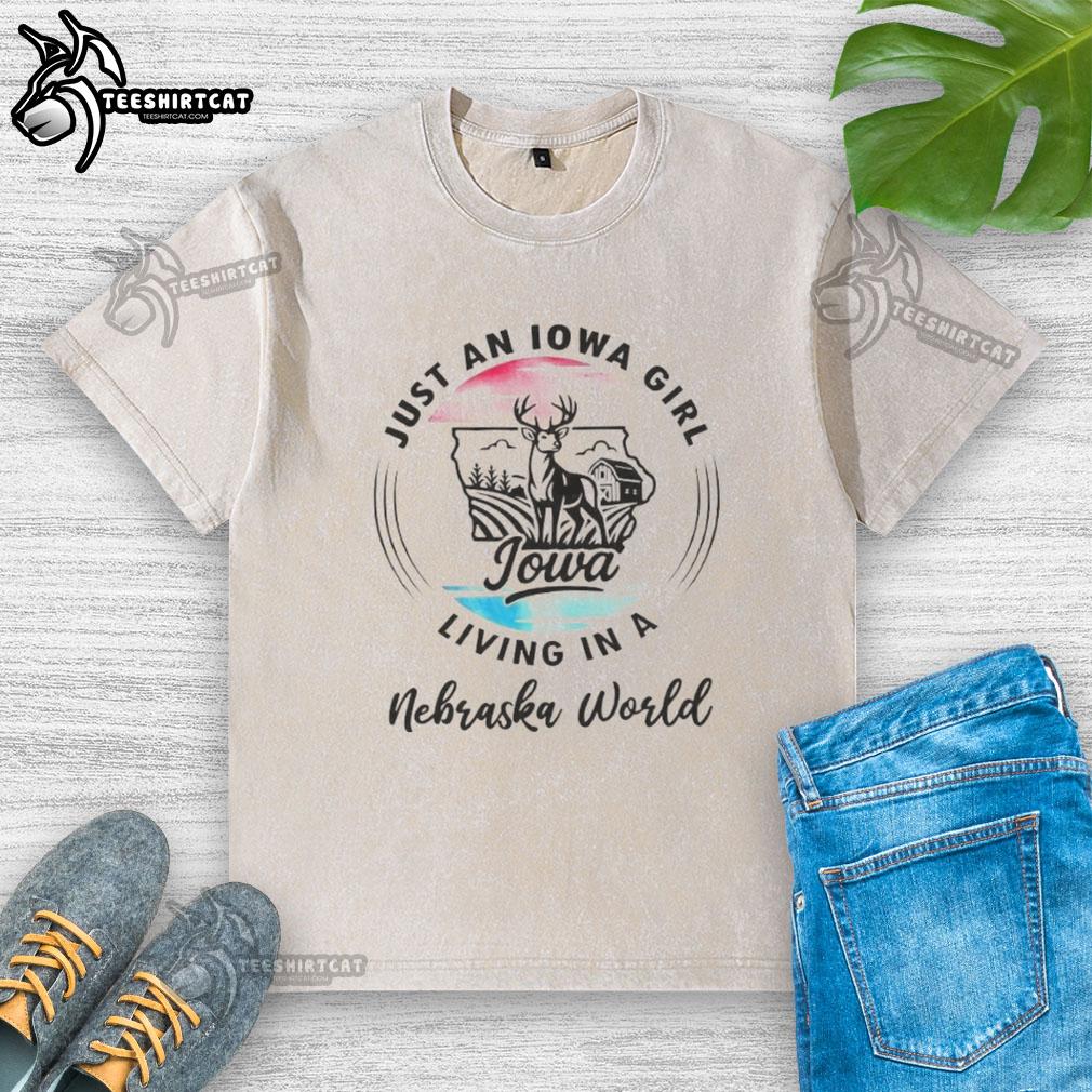 official-just-an-iowa-girl-living-in-a-nebraska-world-washed-t-shirt Alt Text: Official Just an Iowa Girl Living in a Nebraska World washed t-shirt showcasing Midwest pride and casual style.