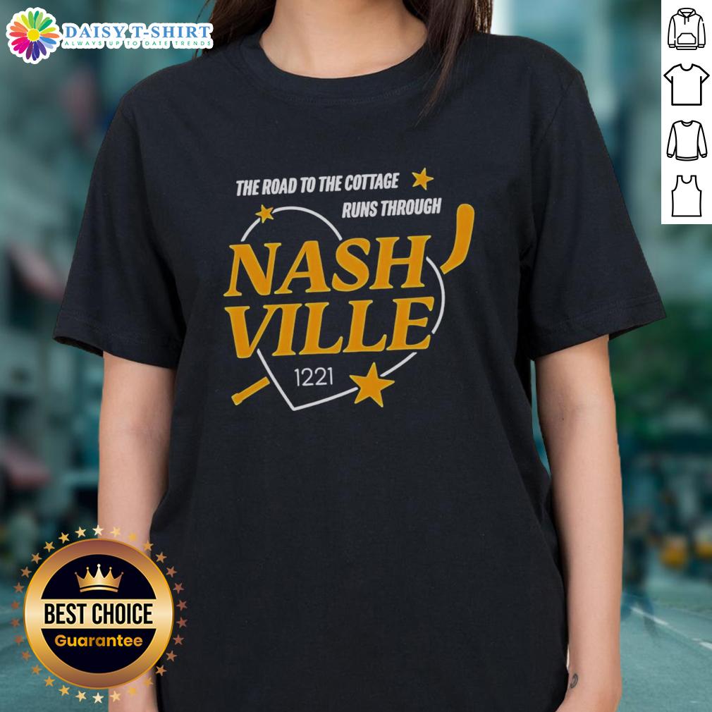 Official Nashville Predators The Road To The Cottage Runs Through Ladies Tee Official Nashville Predators 'The Road to the Cottage Runs Through' ladies tee, featuring team colors and logo design.