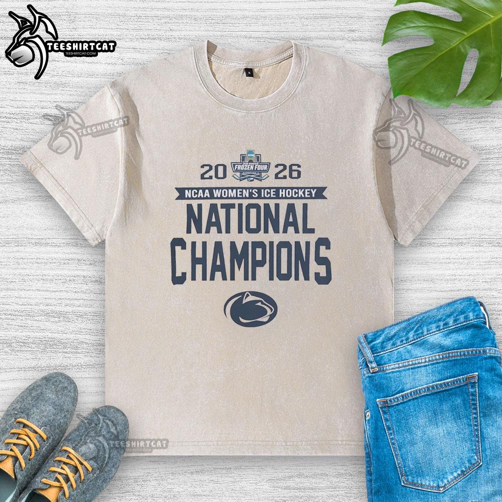 official-penn-state-nittany-lions-frozen-four-champions-2026-washed-t-shirt Alt Text: Official Penn State Nittany Lions Frozen Four Champions 2026 washed t-shirt displayed on a wooden background.