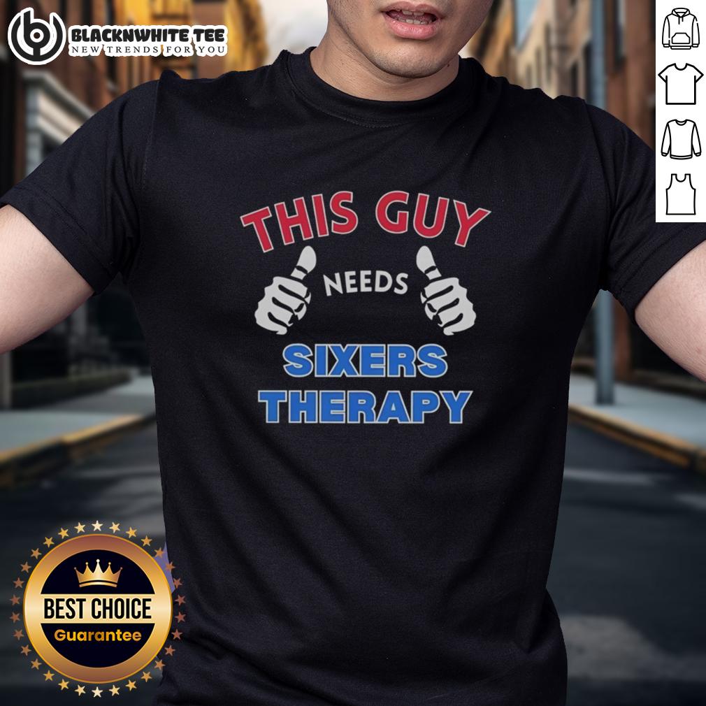 Official Philadelphia 76Ers This Guy Needs Sixers Therapy T Shirt Alt Text: Official Philadelphia 76ers 'This Guy Needs Sixers Therapy' T-Shirt featuring bold graphics and team colors.