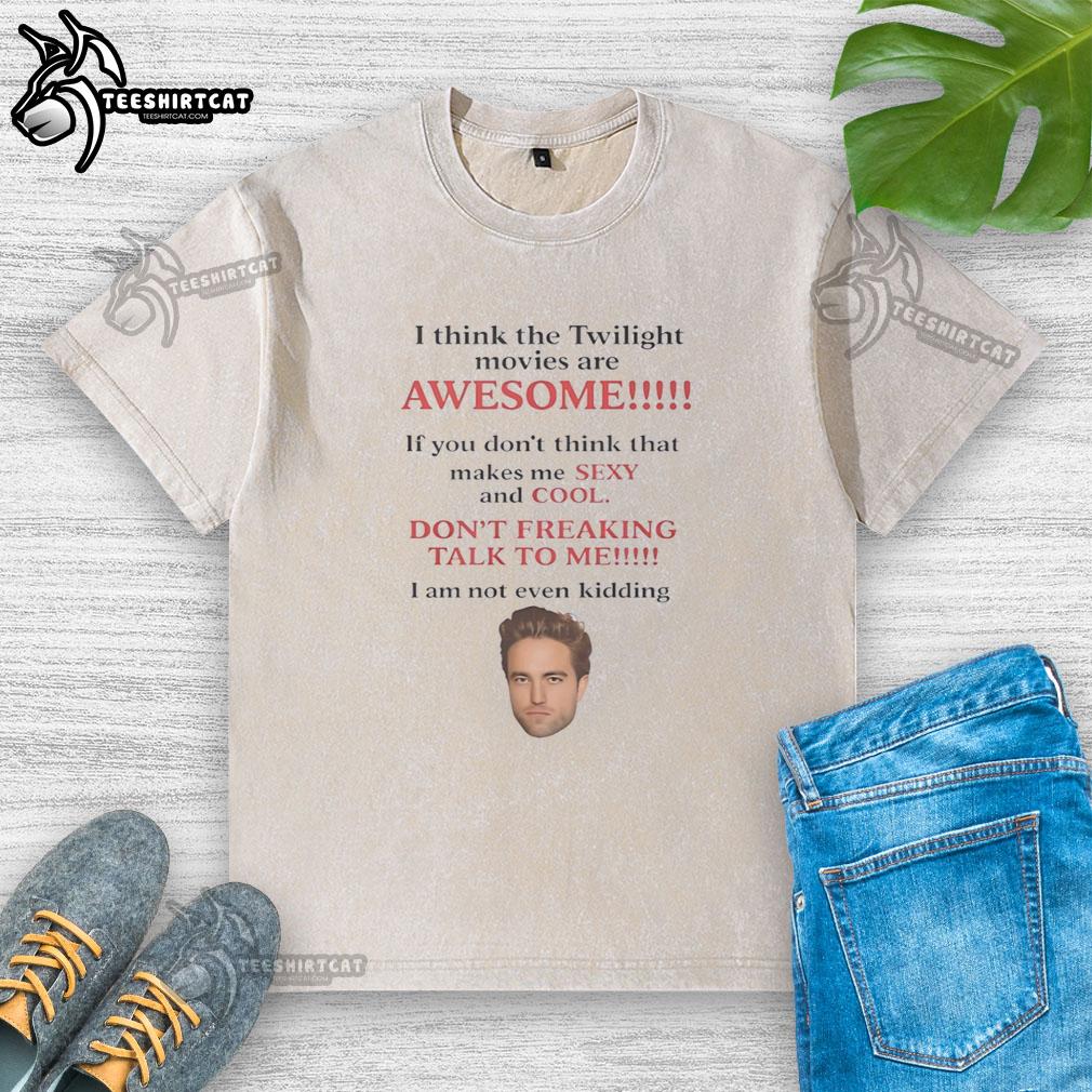 official-robert-pattinson-i-think-the-twilight-movies-are-awesome-washed-t-shirt Robert Pattinson wearing a washed t-shirt, expressing his love for the Twilight movies in a casual setting.