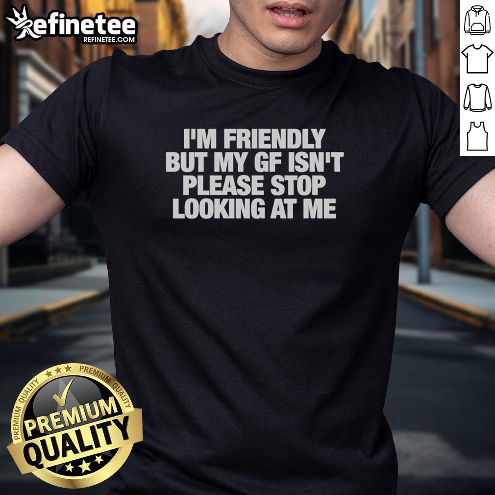 original-im-friendly-but-my-gf-isnt-please-stop-looking-at-me-t-shirt-1 Alt Text: Original I'M Friendly But My Gf Isn't T-Shirt design featuring bold text on a casual tee for humorous style lovers.