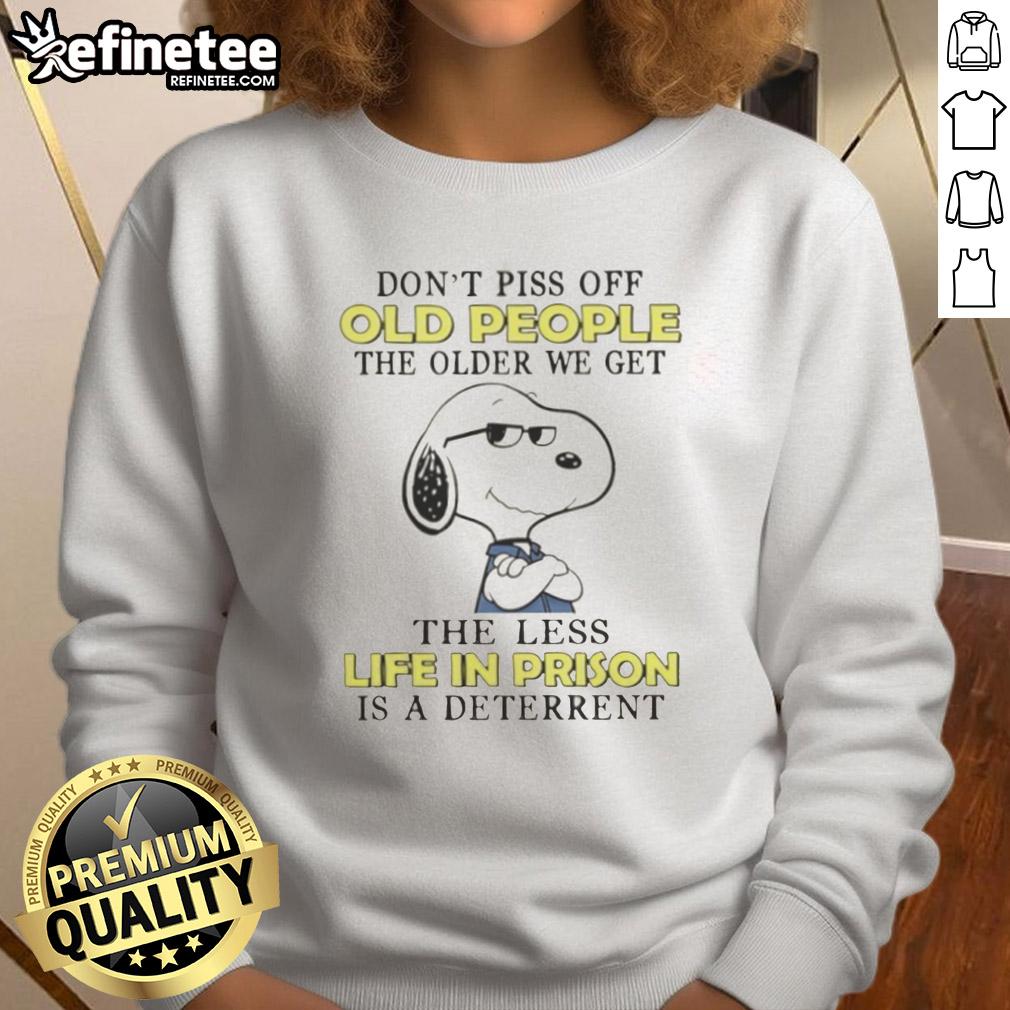 original-snoopy-dont-piss-off-old-people-the-older-we-get-the-less-life-in-prison-is-a-deterrent-sweatshirt Alt Text: Original Snoopy sweatshirt with quote about aging and prison deterrence, featuring a playful design and vibrant colors.