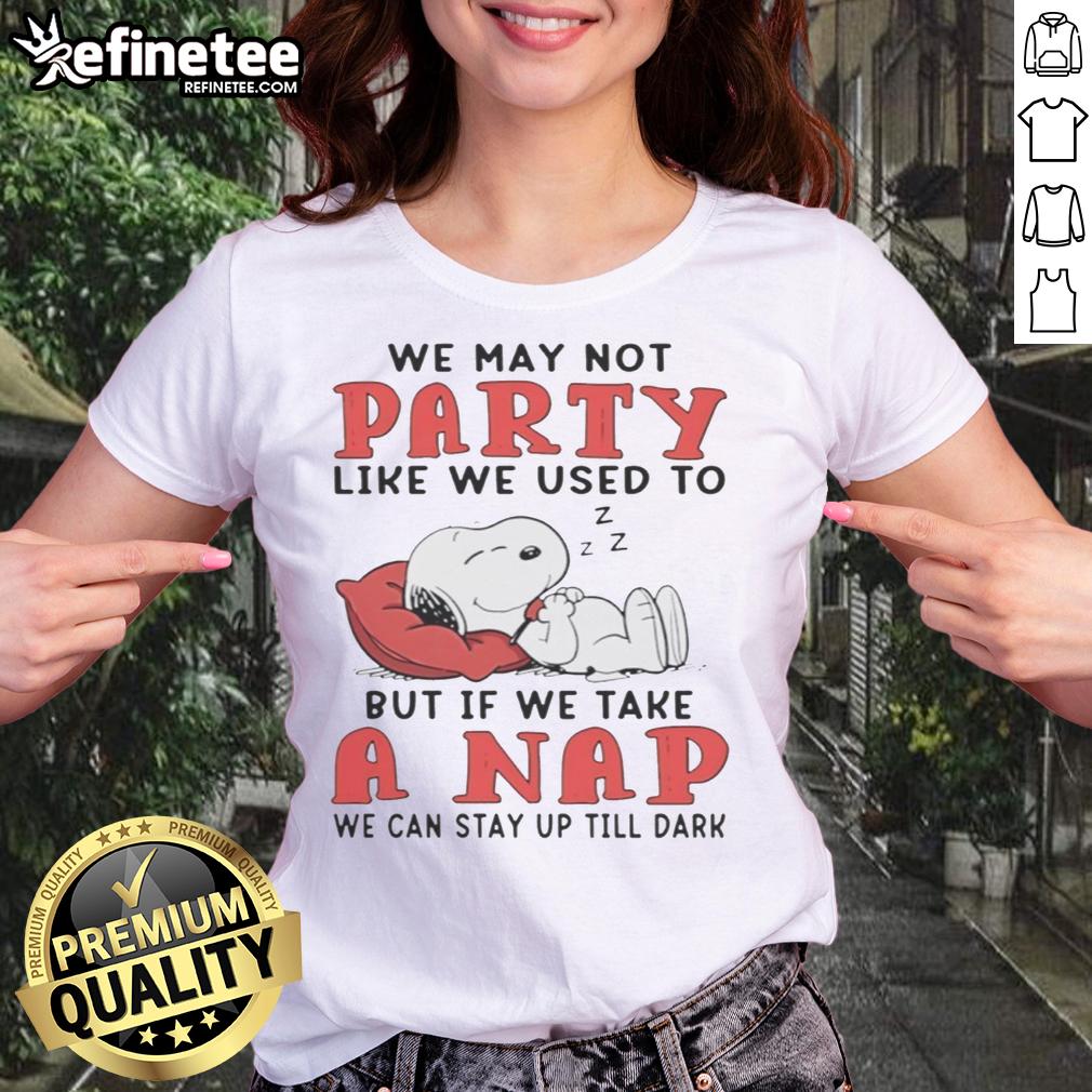 original-snoopy-we-may-not-party-like-we-used-to-but-if-we-take-a-nap-we-can-stay-up-till-dark-ladies-tee Alt Text: Original Snoopy 'We May Not Party Like We Used To' Ladies Tee featuring Snoopy taking a nap, perfect for casual wear.