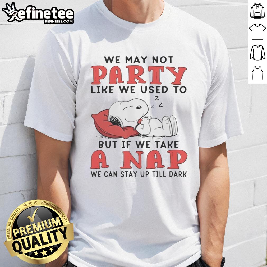 original-snoopy-we-may-not-party-like-we-used-to-but-if-we-take-a-nap-we-can-stay-up-till-dark-t-shirt Alt Text: Original Snoopy t-shirt featuring the quote about napping and staying up late, perfect for dog lovers and fans.