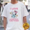 Alt Text: Original Snoopy wearing a pink bow on a 'I Love Ladies Who Tattoo' T-shirt, perfect for tattoo enthusiasts and fans.