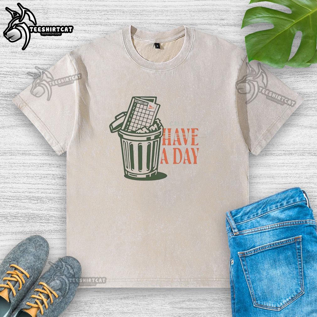 original-the-call-it-a-day-scorecard-in-trash-washed-t-shirt Alt Text: Original Call It A Day Scorecard on a washed T-shirt, showcasing unique design and vintage style.