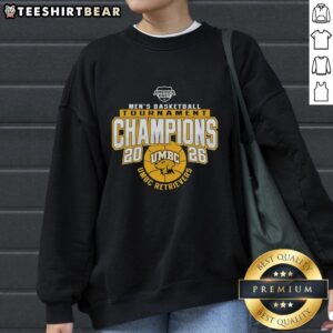 UMBC Retrievers Men's Basketball Tournament Champions 2026 sweatshirt featuring team colors and logo.