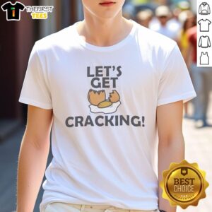 Alt Text: Top Let's Get Cracking egg graphic T-shirt featuring a fun egg design, perfect for casual wear and egg enthusiasts.