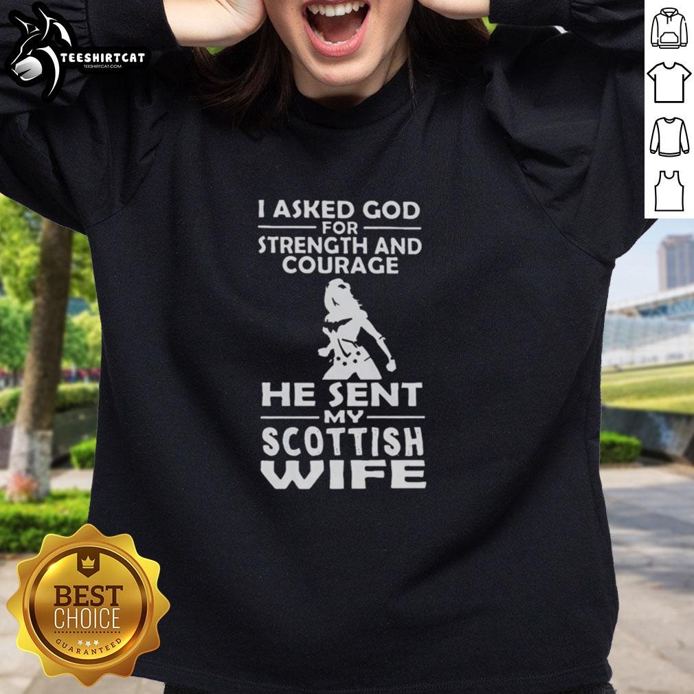 premium-i-asked-god-for-strength-and-courage-he-sent-my-scottish-wife-sweatshirt Premium sweatshirt with 'I Asked God For Strength And Courage, He Sent My Scottish Wife' design, perfect for proud husbands.